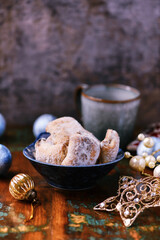 Traditional christmas cookies in a bowl on a rustic wooden background. Soft focus.	