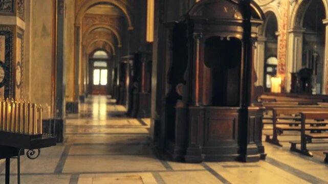 Blurred church interior with shallow bokeh, marble floor, wooden pew and confessional booths, church; backplate copyspace backdrop calm.
