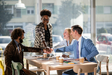 Diverse business team stacking hands for unity and success