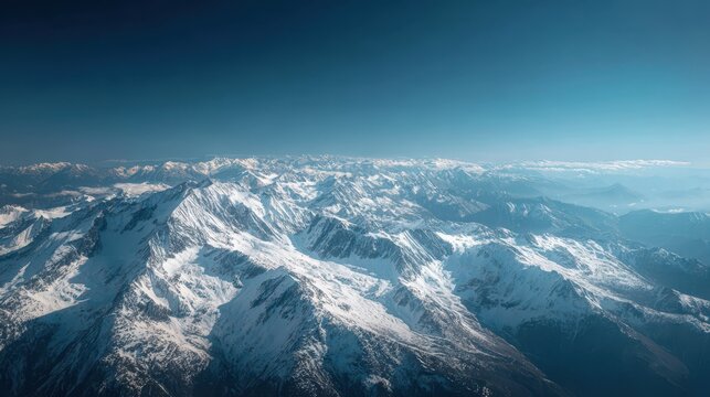 Majestic snow-capped mountains under a clear blue sky captured during a serene daytime view over the high peaks - Powered by Adobe