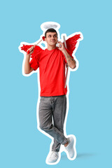 Obraz premium Young man dressed as Cupid with arrow talking by mobile phone on blue background. Valentine's Day celebration