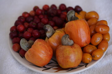 Typical vitamin C-rich tropical fruits from Brazil: Cashew apple (Anacardium occidentale), Acerola (Malpighia glabra), Ciriguela (Spondias purpurea). Fortaleza – Ceará, Brazil.
