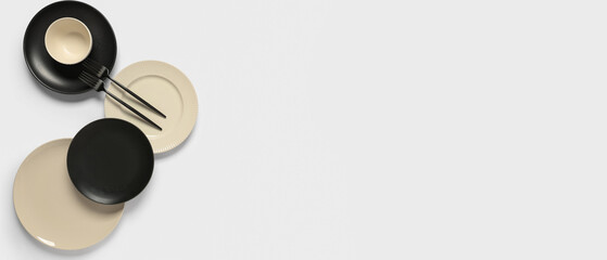 Stylish ceramic plates with forks on white background