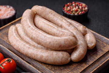 Raw pork or chicken meat sausages for grilling, a spicy picnic food. Raw sausages