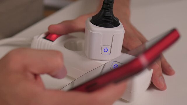 Smart device setup, User demonstrates smart socket connection, Closeup of smart plug pairing process, Installation and control of European style smart socket device