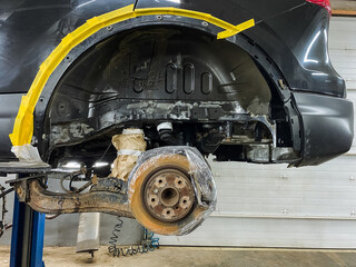 vehicle part inspection, exposed hub and suspension overview, detailed examination of suspension...
