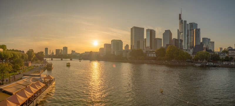 Looking over the river Main towards the skyline as the sun sets 