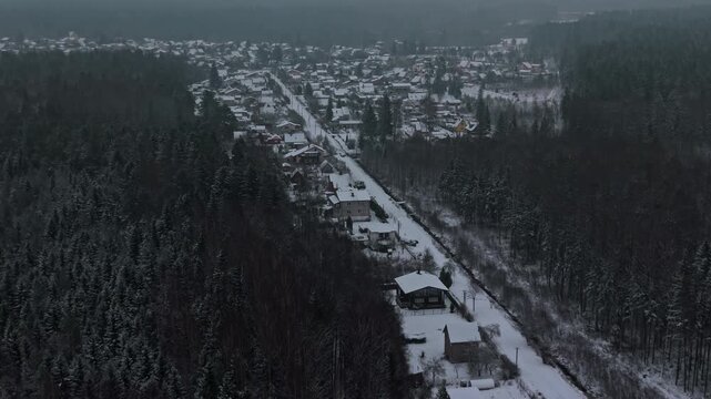 Forest edge neighborhood overview, Scattered homes on scenic rural neighborhood with winter backdrop