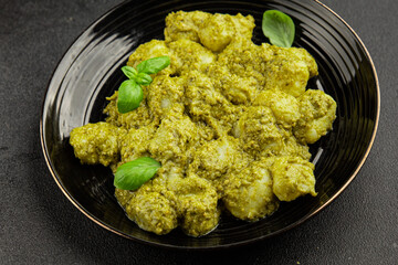 Gnocchi pesto sauce green tasty snack fresh gourmet food background on the table rustic top view copy space vegerian and vegan food
