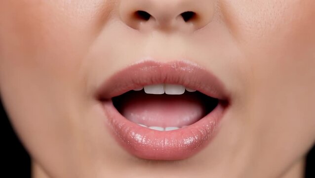 Close-Up of Female Asian Face with Pursed Lips and Glossy Skin