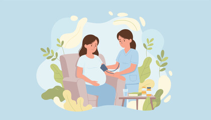Nurse checking blood pressure of pregnant woman during home prenatal care visit