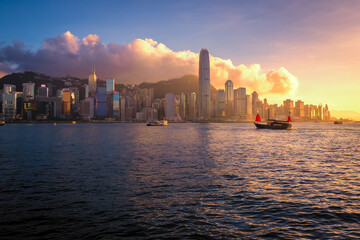 Awesome view of Victoria Harbour and Hong Kong's fantastic skyline, with its impressive skyscrapers, against dramatic sunset and sky, Hong Kong, China