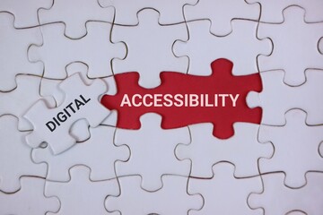 A close-up of interlocking puzzle pieces highlighting digital accessibility. The red piece labeled ACCESSIBILITY and a white piece labeled DIGITAL, symbolizing inclusive technology and design.