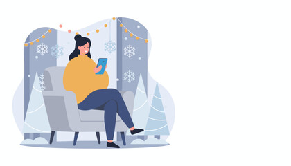 Woman enjoys cozy winter comfort texting on her phone by a festive window