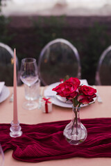 Coziness and style. Modern event design. Table setting at wedding reception. Floral compositions...