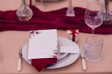 Coziness and style. Modern event design. Table setting at wedding reception. Floral compositions...