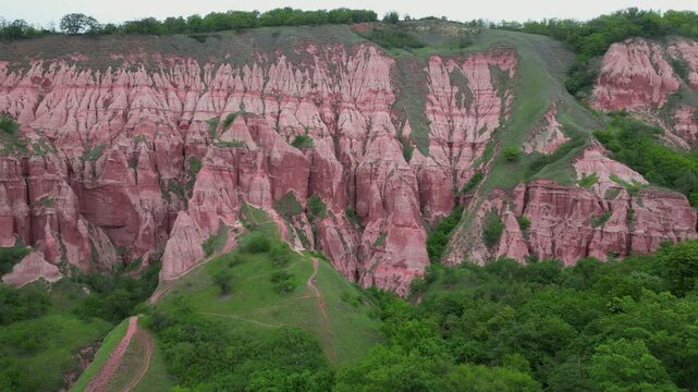 Red ravine badlands and eroded geological monument Rapa Rosie in Transylvania, a protected area