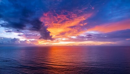 Fototapeta premium Colorful Sunset Over Ocean Colorful Clouds Beautiful Horizon Line