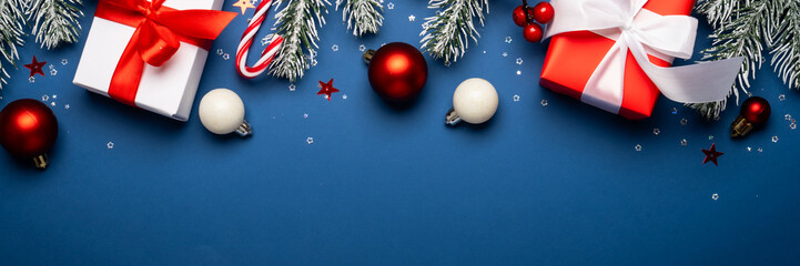Christmas present, balls and fir tree branches.