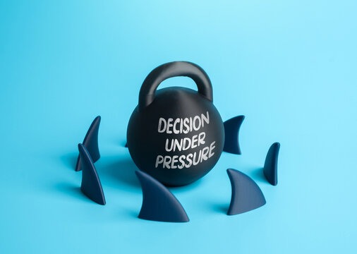 Decisions under pressure. A weight surrounded by shark fins. Leadership challenges, risk management, crisis strategy and psychological pressure.