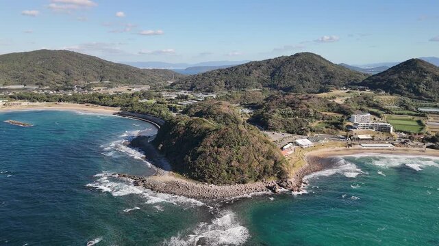 Nishinoura, Nishi Ward, Fukuoka, Japan &ndash; 4K Aerial Drone Footage of Futamigaura Couple Stones, Torii Gate, Rocky Coastline, Blue Ocean, Mountain Forests, Coastal Town, Japan Beach