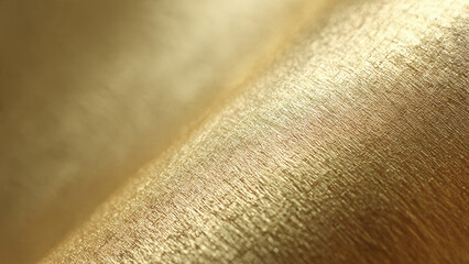 Close-up of a luxurious, shimmering golden textured surface with a diagonal fold, creating elegant light reflections and rich abstract background.