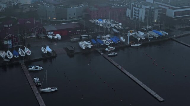 Boat dock scene, Marina with boats and activity, Busy waterfront showing ships and maintenance activity