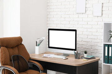 Workplace with modern computer, stationery and keyboard in stylish office