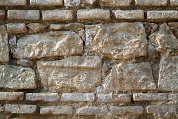 A wall made of stone with a rough texture