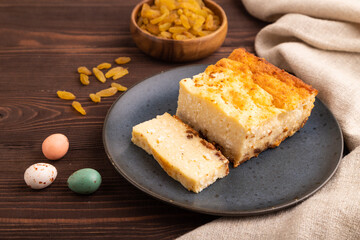 Сottage cheese Сasserole, Curd cake, with dried apricots and raisins on brown wooden, side view, close up