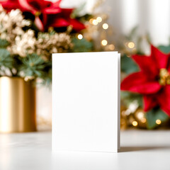 Holiday card mockup placed among red poinsettias and festive greenery