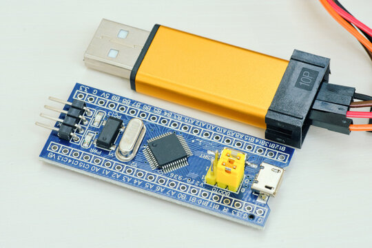 Programming board of Arduino UNO in blue colour isolated in white background - Powered by Adobe