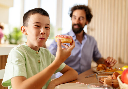 Father and son sharing breakfast together