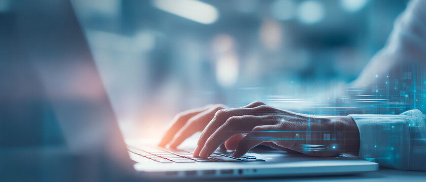 A close-up of a person's hands typing on a laptop, with a digital overlay suggesting technology and data interaction.