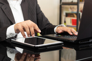 a CEO male hand over a white tablet ready to show something on the space