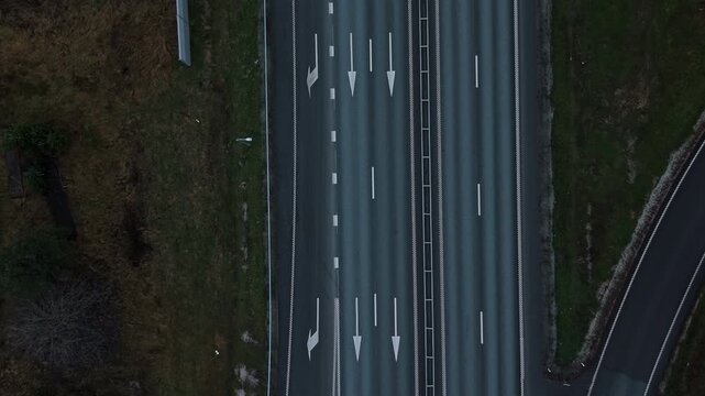 Highway crossing with structural supports, Elevated roadway spanning with industrial shadows present