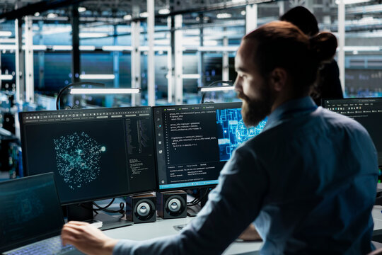 Data center programmer adjusting AI model parameters to upgrade systems. Server room IT professional scheduling artificial intelligence ran maintenance for infrastructure components - Powered by Adobe