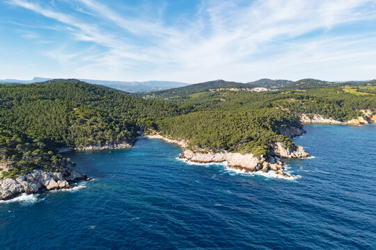 Mediterranean coastline at Port d Alon near La Ciotat, aerial video showing pine forests, rocky shores and azure waters