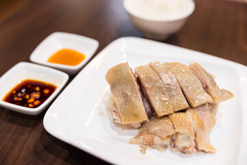 Asian cuisine steamed chicken with herbs and vegetables