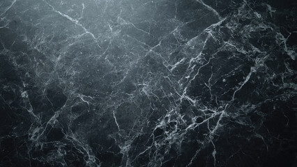 A dramatic close-up of dark grey marble with intricate white veining, creating a rich and elegant natural stone texture perfect for backgrounds.