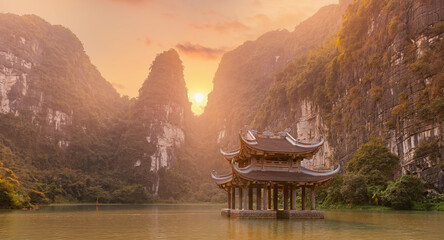 Scenic beauty of Trang An in Tam Coc National Park of Ninh Binh, majestic limestone mountains and...