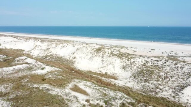 Aerial flyover of Anastasia State park, beaches and sand dunes along the coast of Florida.