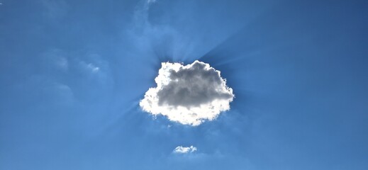 Beautiful blue sky with fluffy white clouds and copy space for background