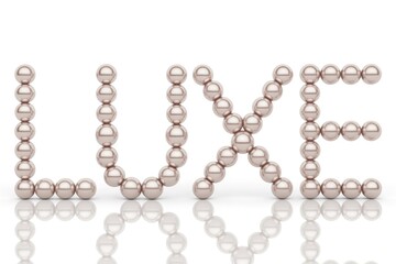 The word 'LUXE' elegantly spelled out with lustrous, champagne-colored pearls on a reflective white background, symbolizing luxury and sophistication.