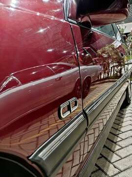 Reflection of vintage Chevrolet Sedan Opala seen from the paint of a vintage omega CD sedan.  Itabira, Minas Gerais, Brazil. november, 20, 2025