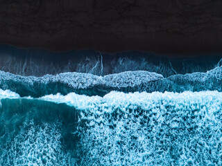 Black sand beach with crashing waves Atlantic ocean, Serene and tranquil landscape, Black sand of volcanic origin aerial view