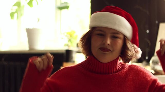 Christmas, face and woman in satnas hat at home, cheering and celebration. Xmas, tradition and person with happiness, festive season and smile with culture, holiday and dance with good news