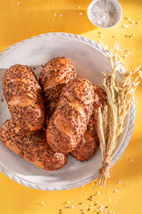 Tasty and homemade flax seed buns freshly baked in bakery.