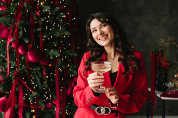 Girl with champagne glass celebrating New Year and Christmas holiday fun.