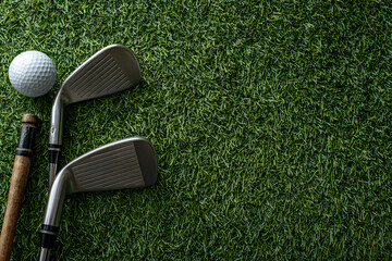 Flat lay composition with golf equipment on artificial grass, space for text